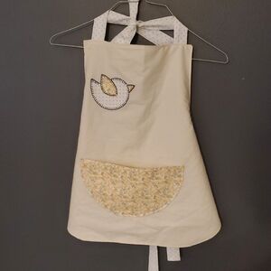 Charming Cream Bib with Yellow Floral Pocket